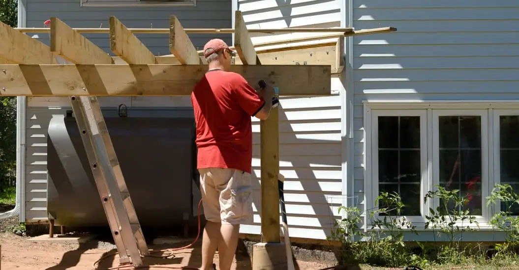 Man building a DIY deck