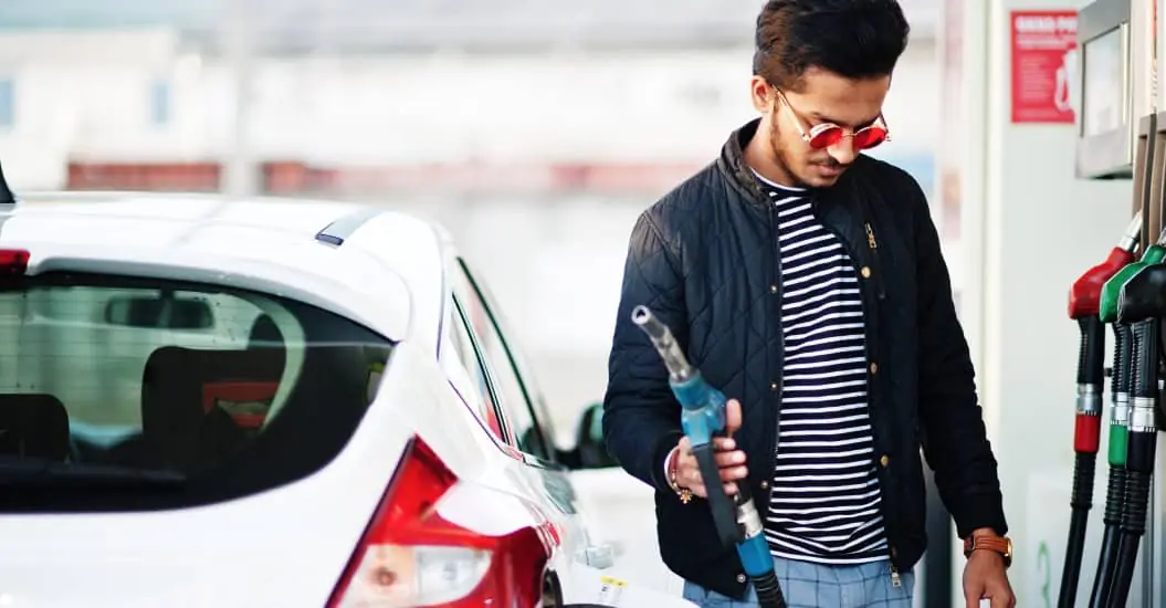 Man pumping petrol into his car