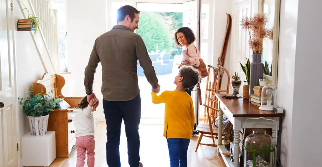 Family leaving their home to go on holiday