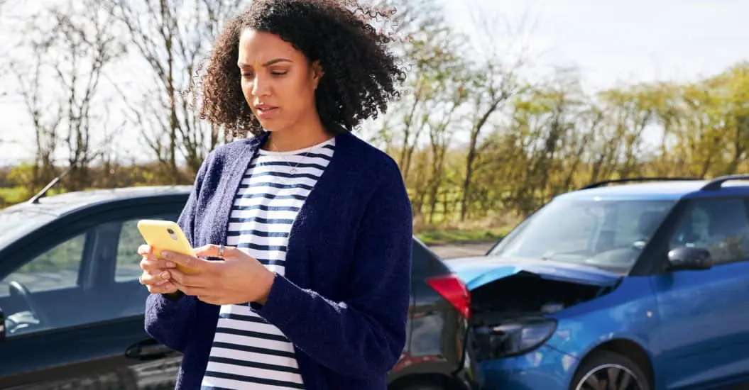 Woman calling for help following a car accident