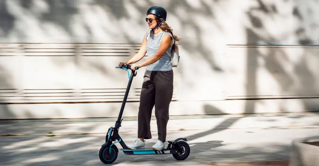 Lady rides an e-bike that uses lithium ion batteries